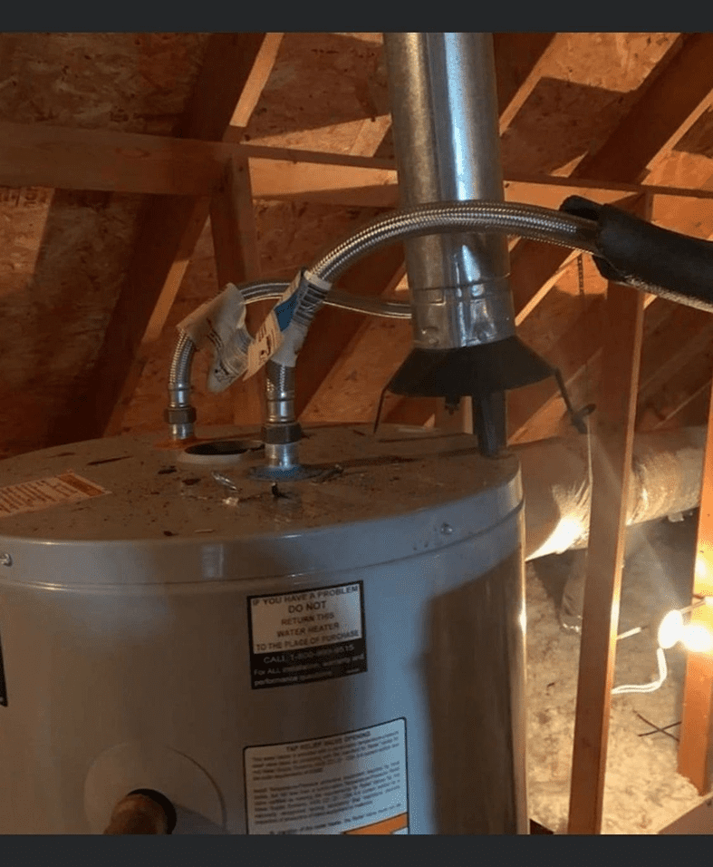 Water heater installed in an attic space.