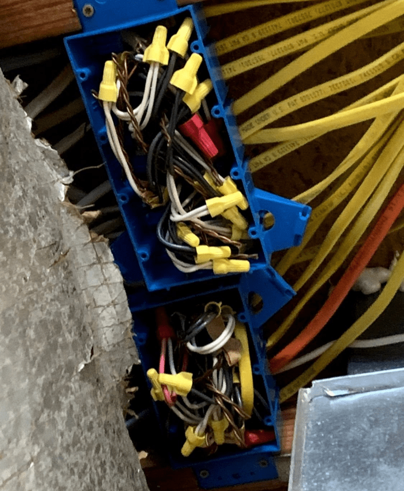 Electrical wires in blue junction boxes.